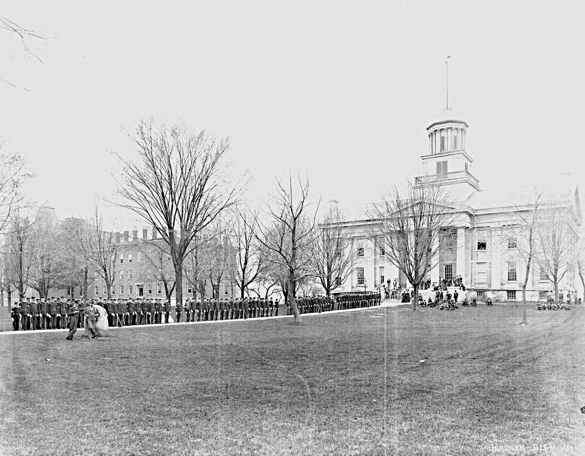 A military drill on the sidewalk east of Old Capitol